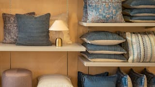 Explore a welcoming furniture showroom where you can see, feel, and experience a curated selection of lighting, dining furniture, and home décor in a warm, inviting setting.