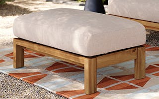 Styled image of the Cove 34.25" Outdoor Ottoman in Basket Beige