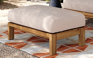 Styled image of the Cove 34.25" Outdoor Ottoman in Basket Beige