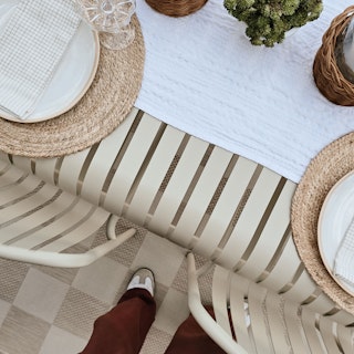 Bowls of cherries and peaches, atop the Sarek Dining Table in Khaki Green. Photo by @cupofjo