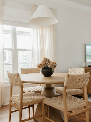 Photo by Emily Faith Home, showing the Corded Wosla Chair and Kurasi Dining Table