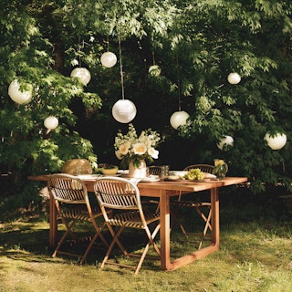 Bright sunny patio featuring the Laholm 88" Outdoor Sofa Set in Dravite Black
