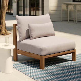 Styled patio with Cove 34.25" Outdoor Armless Chair Module in Basket Beige