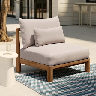 Styled patio with Cove 34.25" Outdoor Armless Chair Module in Basket Beige