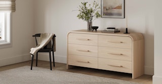 Bright room featuring the Faydra 6-Drawer Double Dresser in Natural Ash