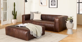 Bright living room featuring the Cigar 92" Leather Sofa and 47" Leather Ottoman in Indiana Brown