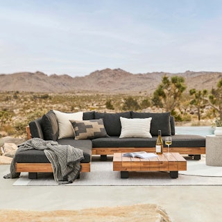 Lubek Corner Sectional Set in Slate Gray, styled with a desert backdrop