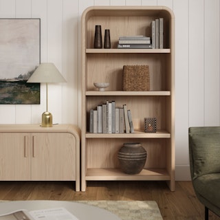 Bright room featuring the Faydra 6-Drawer Double Dresser in Natural Ash