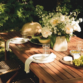 Detail view showcasing woven rope backrest on Laholm 36.5" Outdoor Lounge Chair in Dravite Ivory