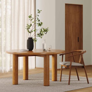 Bright airy dining space featuring the Adel 55.5" Dining Table in Smoked Oak