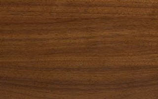 Close-up of the walnut wood finish featured on the legs of the Rhett collection.